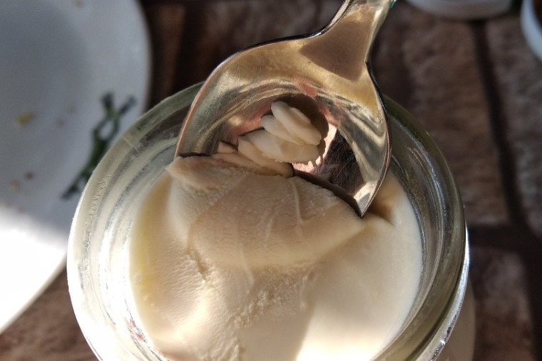 Yogurt in a jar with a spoon