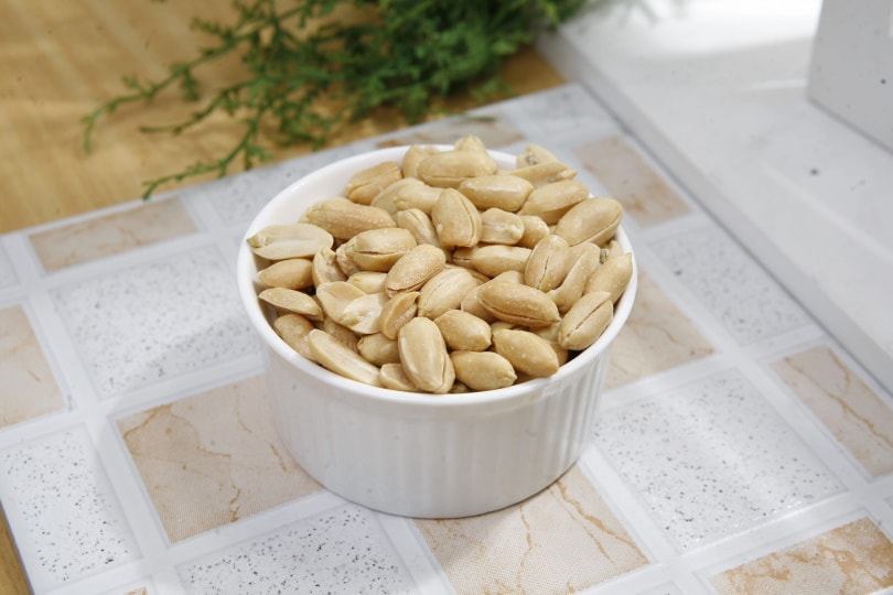 peanuts on white ceramic bow