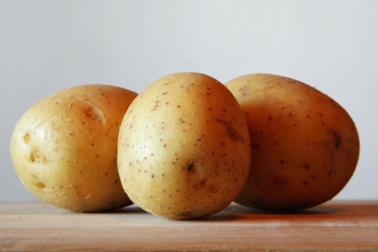 potatoes on woden board