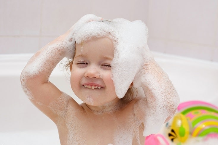 baby having a shampoo bath