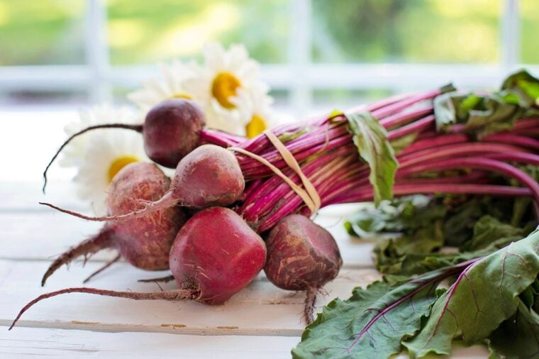 Beets on a white wooden surface