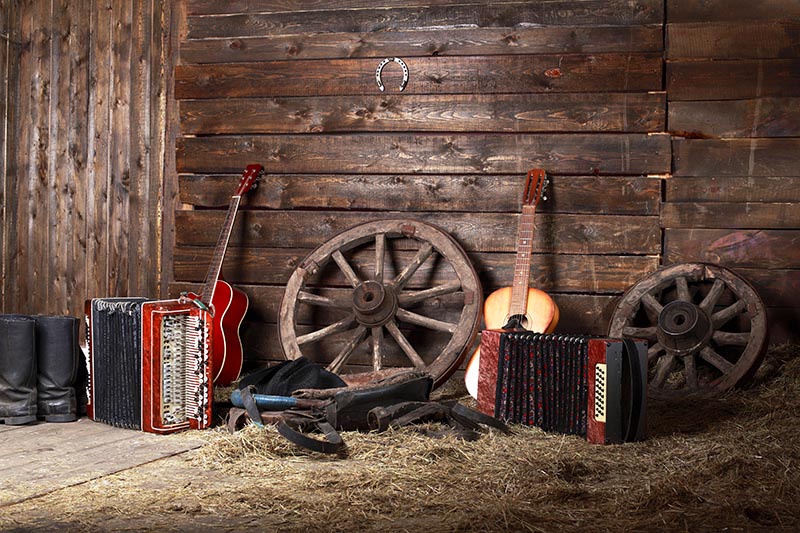 guitar and other instruments inside a barn