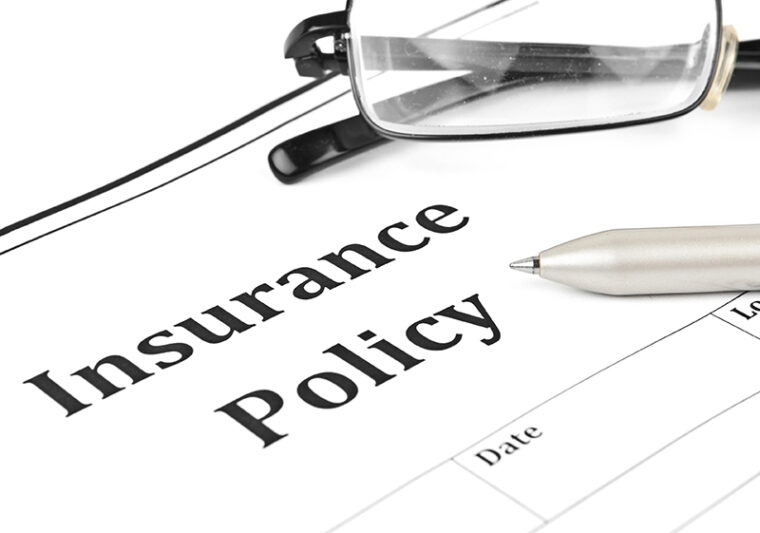 close up insurance policy and eyeglasses