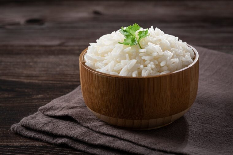 Bowl with cooked rice on the table