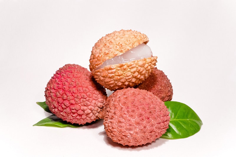 three lychee on white background