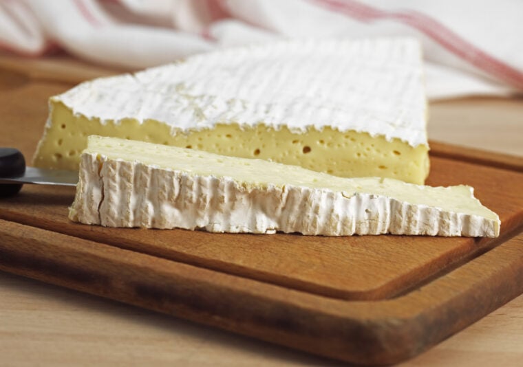 Brie Cheese on wooden surface
