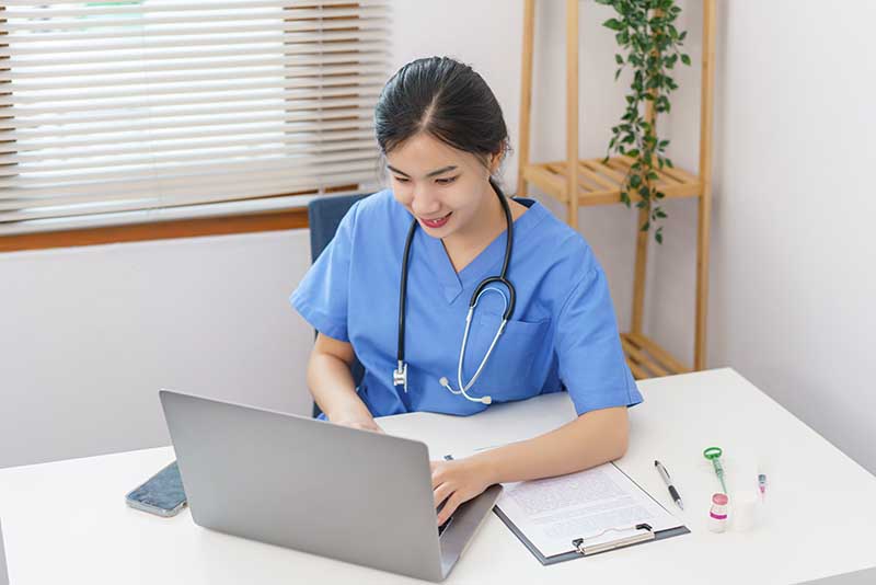 Female veterinary using laptop