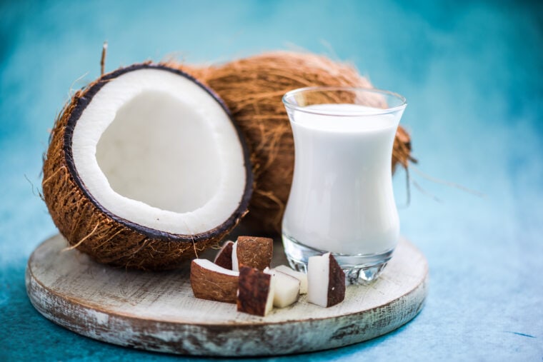 Fresh and healthy coconut milk with whole nut and pieces