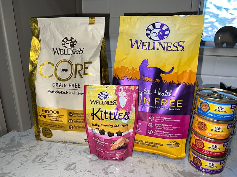 wellness cat food recipes and treats on the countertop