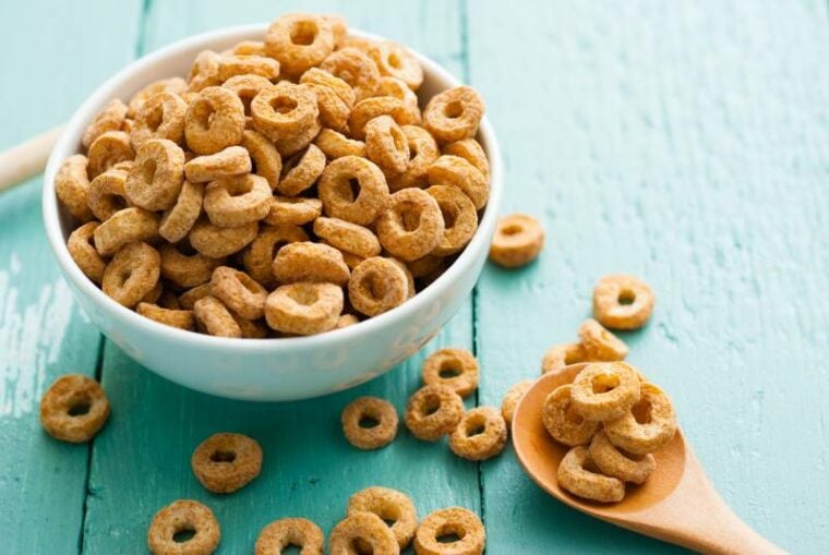 bowl of cheerios cereal on blue wooden table