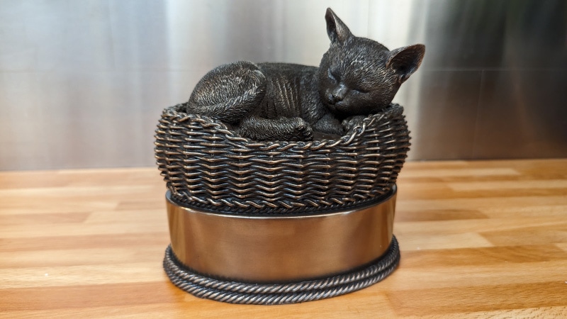 bronze cat in basket cremation urn from perfect memorials