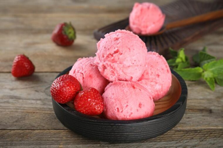 strawberry ice cream on wooden table