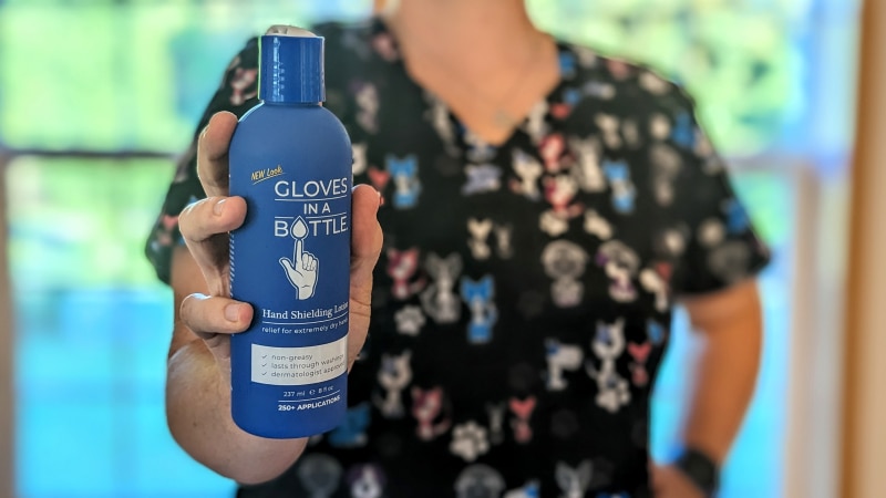Gloves in a Bottle - hand holding the product bottle