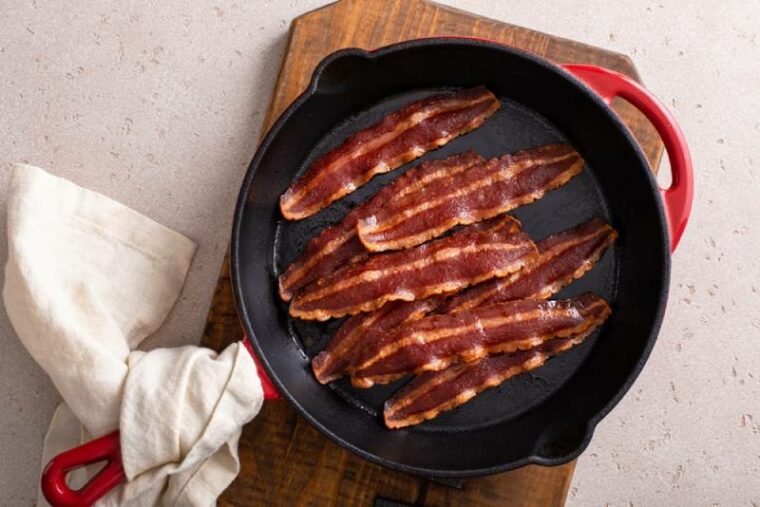 turkey bacon cooked on a cast iron pan